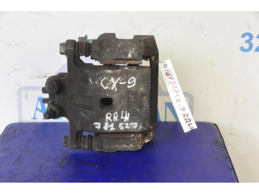 L2Z2-26-99ZA | Суппорт тормозной задн. лев. MAZDA CX-9 06-16