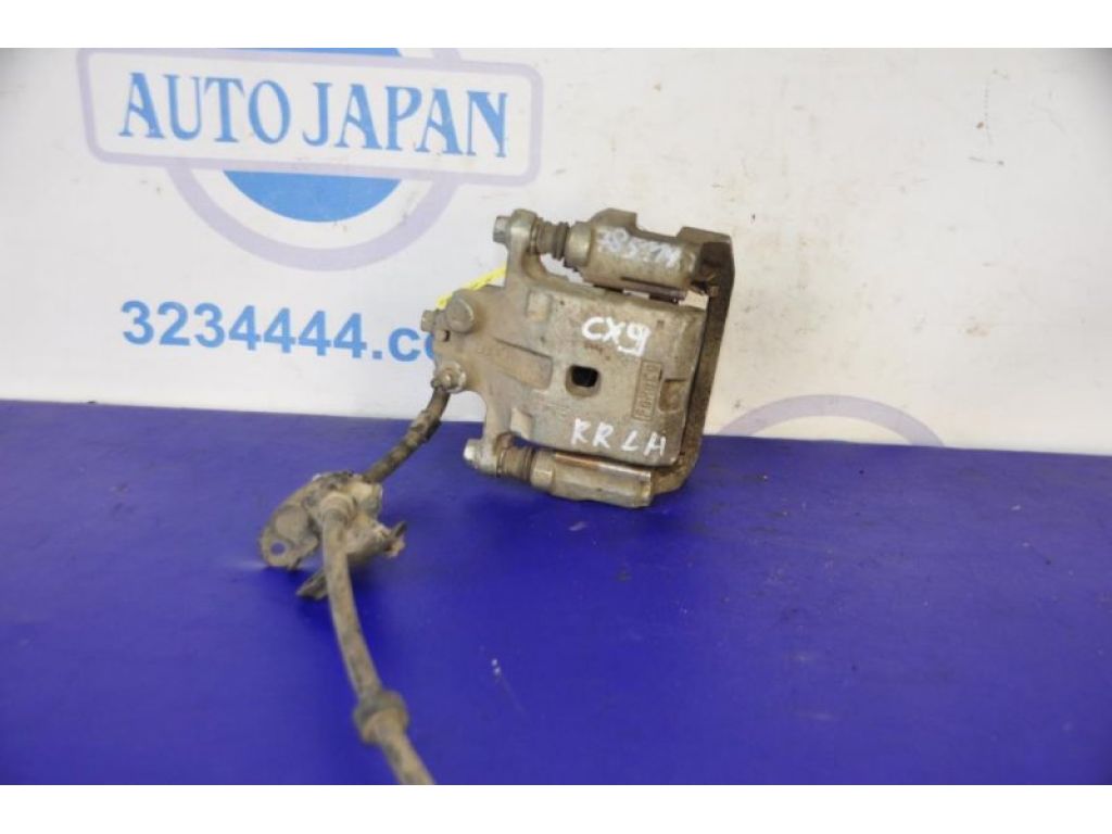 L2Z2-26-99ZA | Суппорт тормозной задн. лев. MAZDA CX-9 06-16