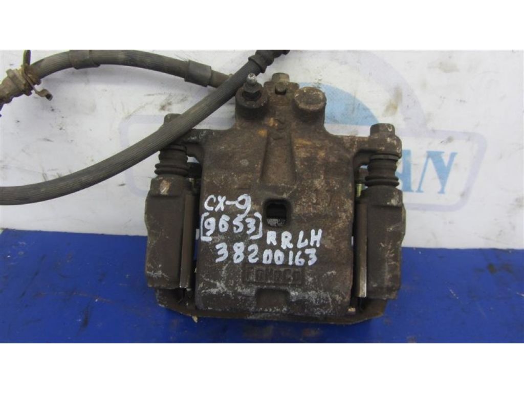 L2Z2-26-99Z | Супорт гальмівний задн. лів. MAZDA CX-9 06-16
