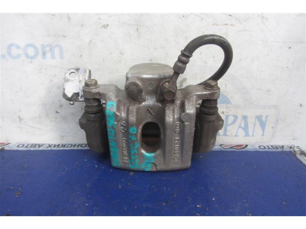 58210-C6000 | Супорт гальмівний задн. лів. KIA SORENTO UM 14-