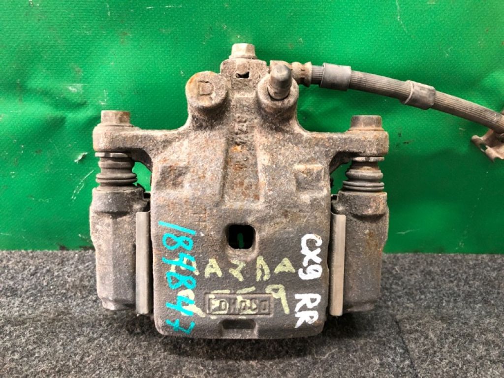 L2Z2-26-98ZB | Суппорт тормозной задн. прав. MAZDA CX-9 06-16
