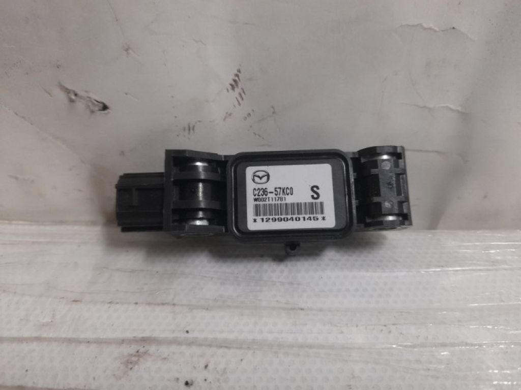 C236-57-KC0 | Датчик удара лев. MAZDA 5 CR 05-10