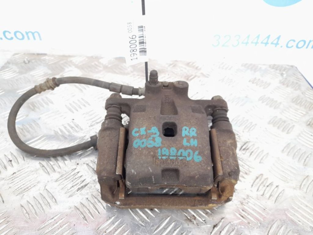L232-26-990F | Суппорт тормозной задн. лев. MAZDA CX-9 06-16