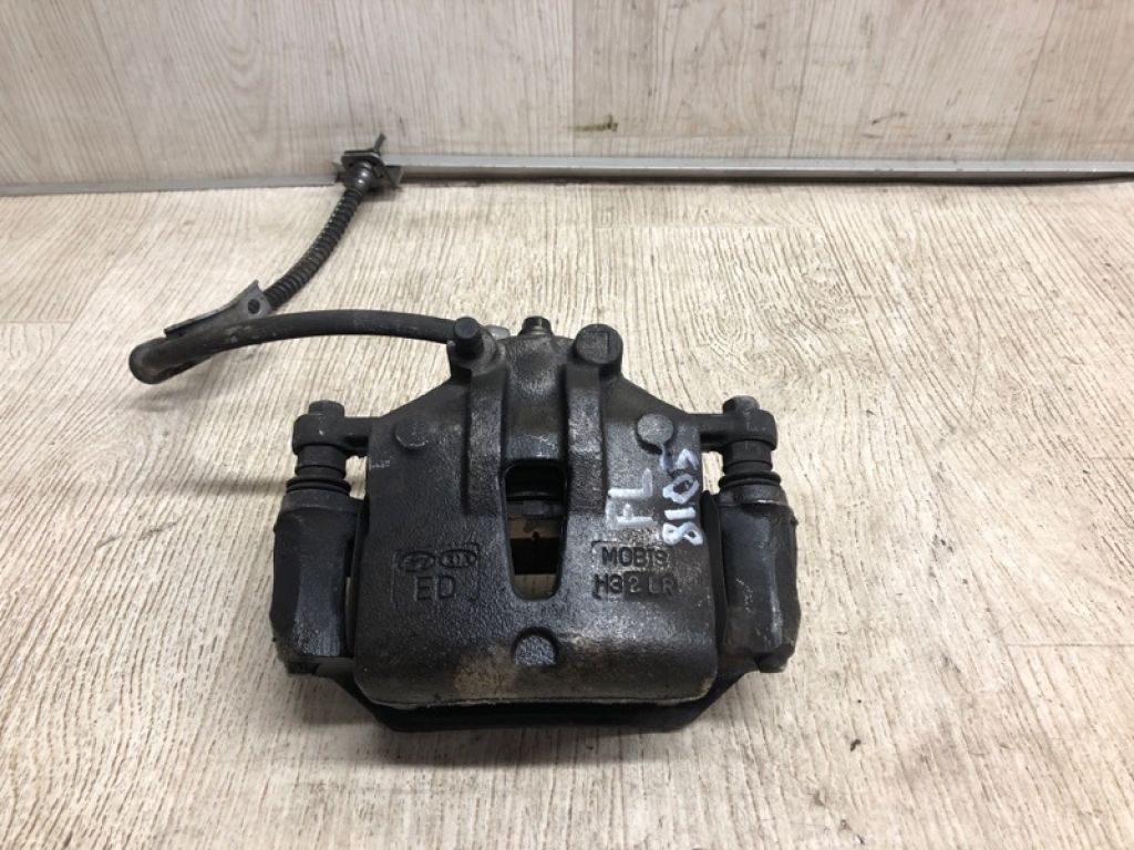 58110-1M100 | Суппорт тормозной передн. лев. KIA FORTE/CERATO TD 08-13