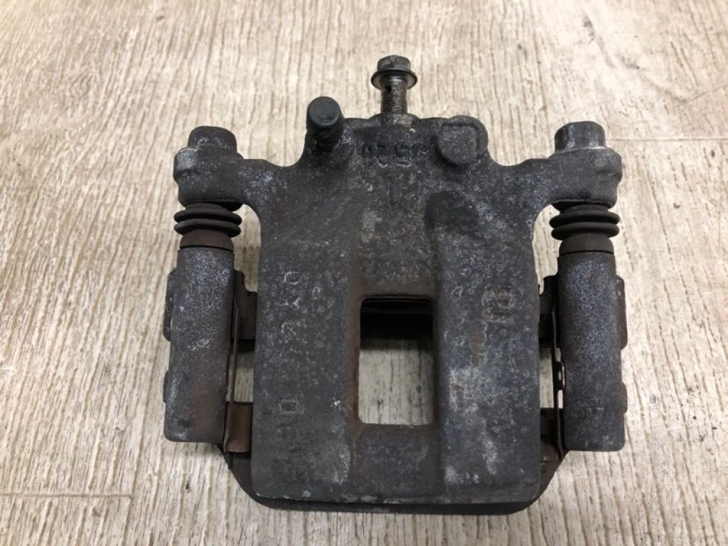 44011-JG00A | Суппорт тормозной задн. лев. NISSAN ROGUE 08-15