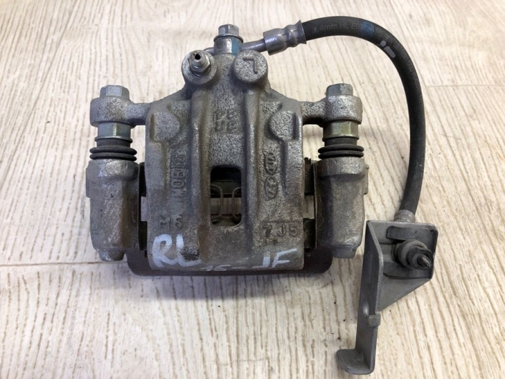 58210-C1150 | Супорт гальмівний задн. лів. KIA OPTIMA JF 15-20