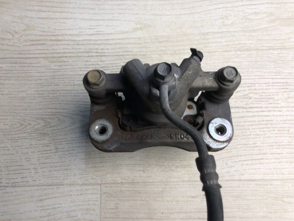 58310-1MA40 | Супорт гальмівний задн. лів. KIA FORTE/CERATO TD 08-13 - Фото 2