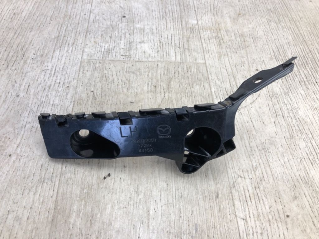 BHN1-50-0U1D | Кронштейн переднего бампера лев. MAZDA 3 BM 13-19