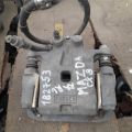 L2Z2-26-99ZA | Суппорт тормозной задн. лев. MAZDA CX-9 06-16