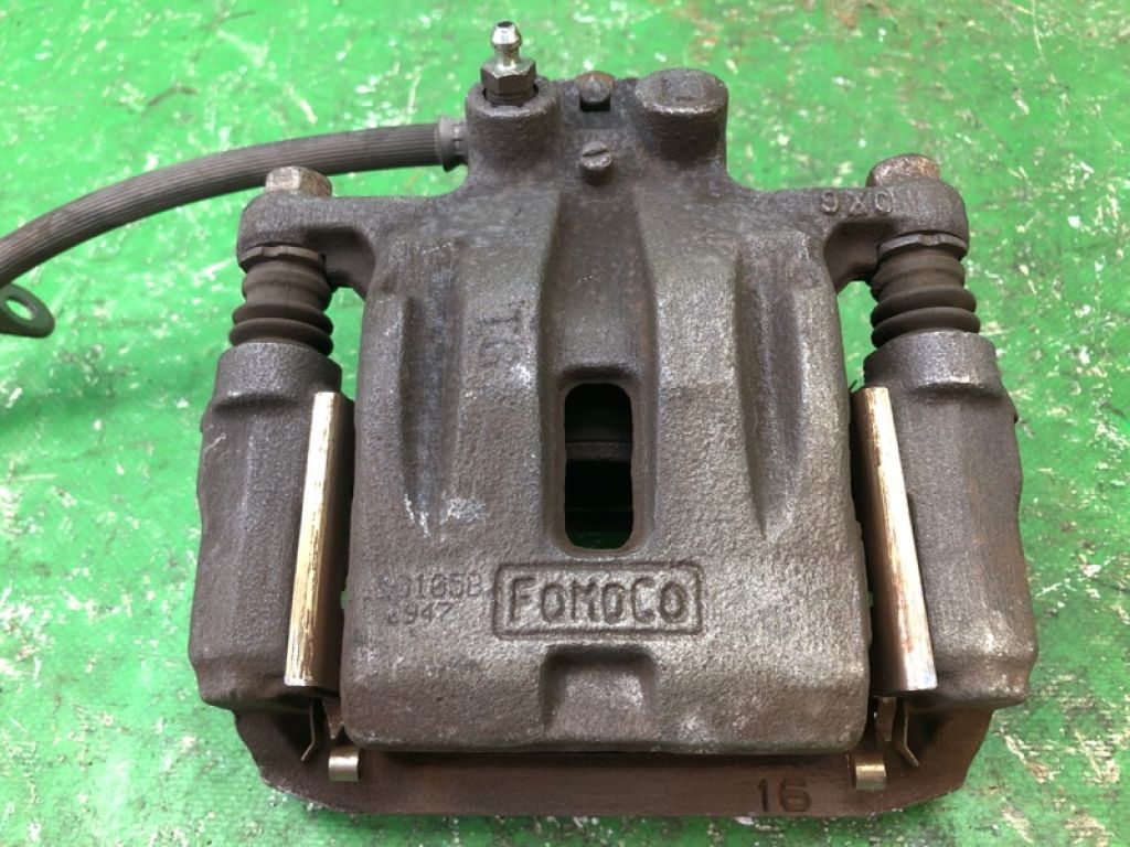 7T4Z-2553-B | Суппорт тормозной задн. лев. FORD EDGE 06-14