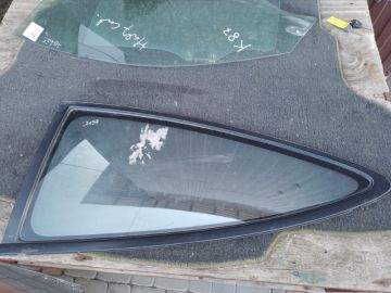 Скло дверей глухе задн. лів. MAZDA 323 BA 94-97