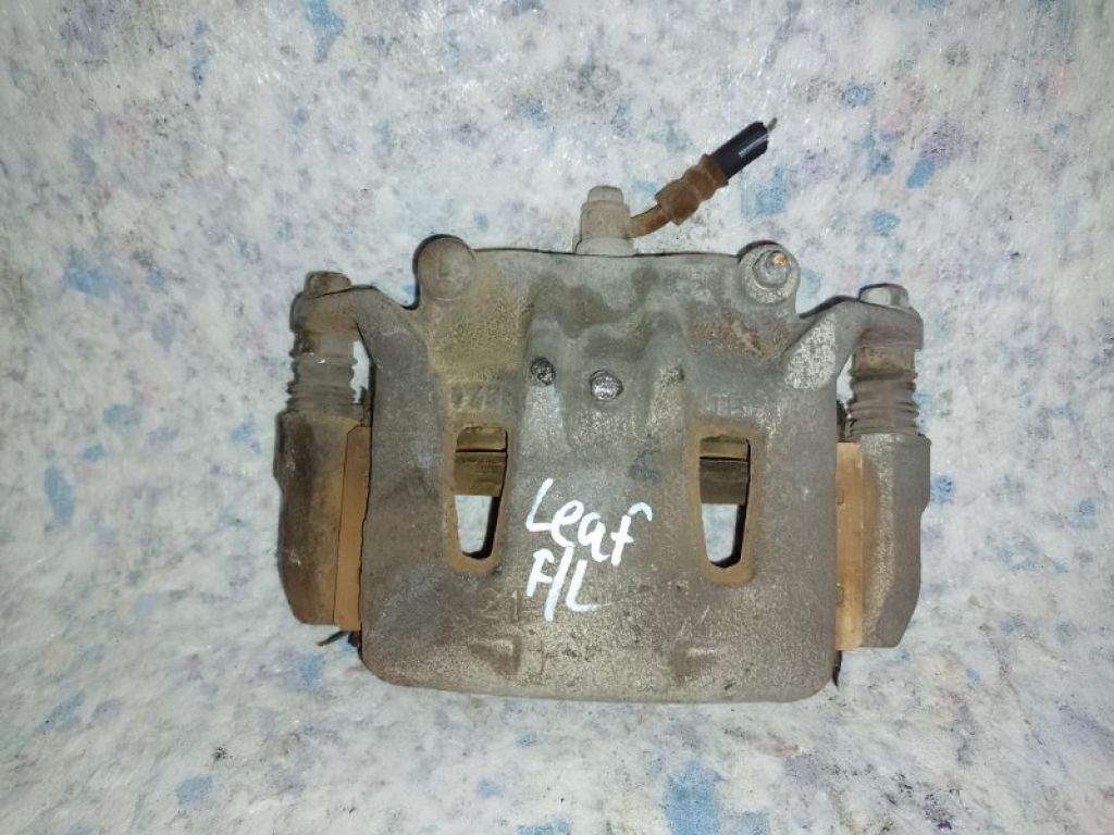 41011-1VA0B | Суппорт тормозной передн. лев. NISSAN LEAF 10-17