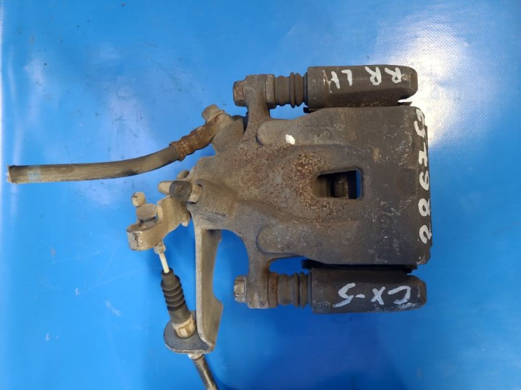 K0Y1-26-99ZA | Супорт гальмівний задн. лів. MAZDA CX-5 (KE) 11-17