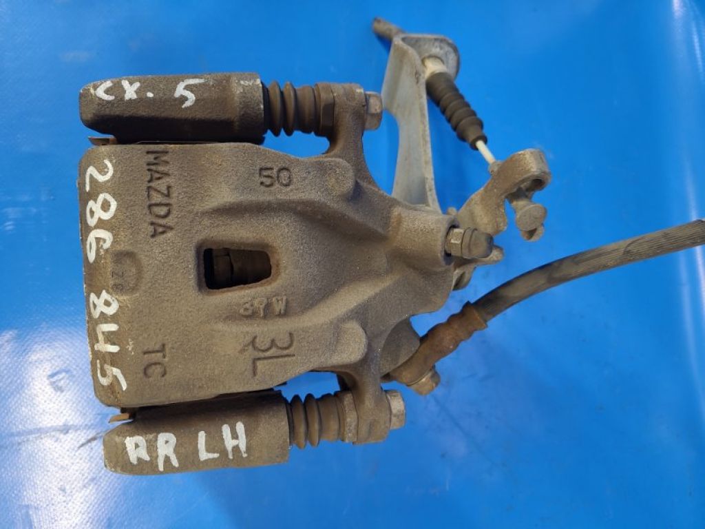 K0Y1-26-99ZA | Супорт гальмівний задн. лів. MAZDA CX-5 (KE) 11-17