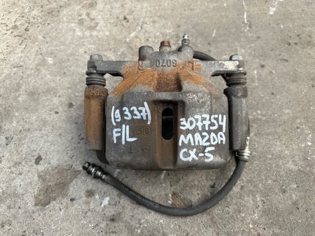 K0Y1-33-99Z | Суппорт тормозной передн. лев. MAZDA CX-5 (KF) 16-21