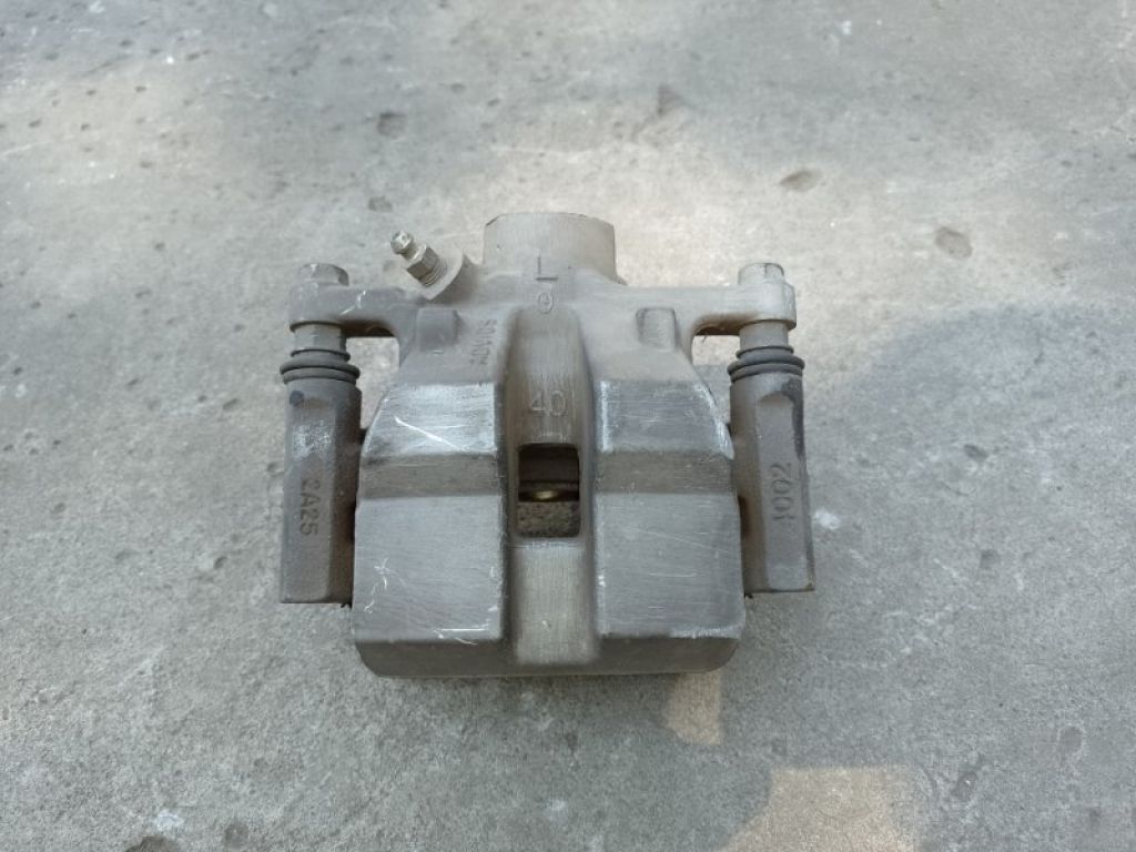 47850-0E021 | Суппорт тормозной задн. лев. TOYOTA SIENNA 11-16