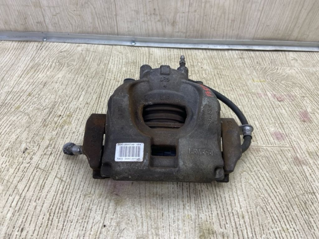 DG9Z-2B121-A | Суппорт тормозной передн. лев. FORD FUSION 14-