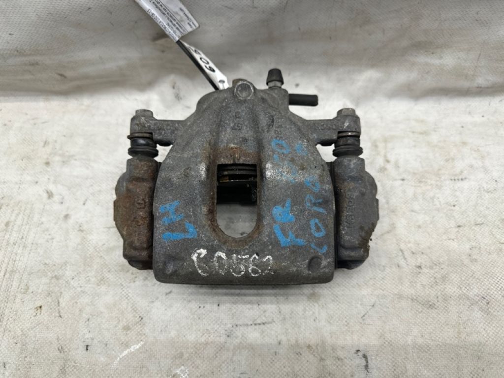 47750-02341 | Суппорт тормозной передн. лев. TOYOTA COROLLA 150 06-13