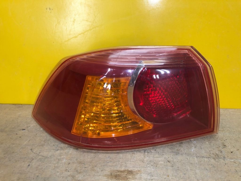 8330A107 | Фонарь наружный лев. MITSUBISHI LANCER X 10 07-15