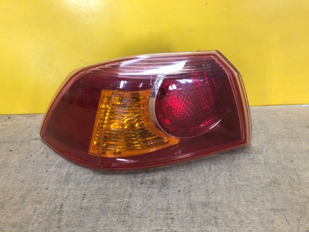 8330A107 | Фонарь наружный лев. MITSUBISHI LANCER X 10 07-15