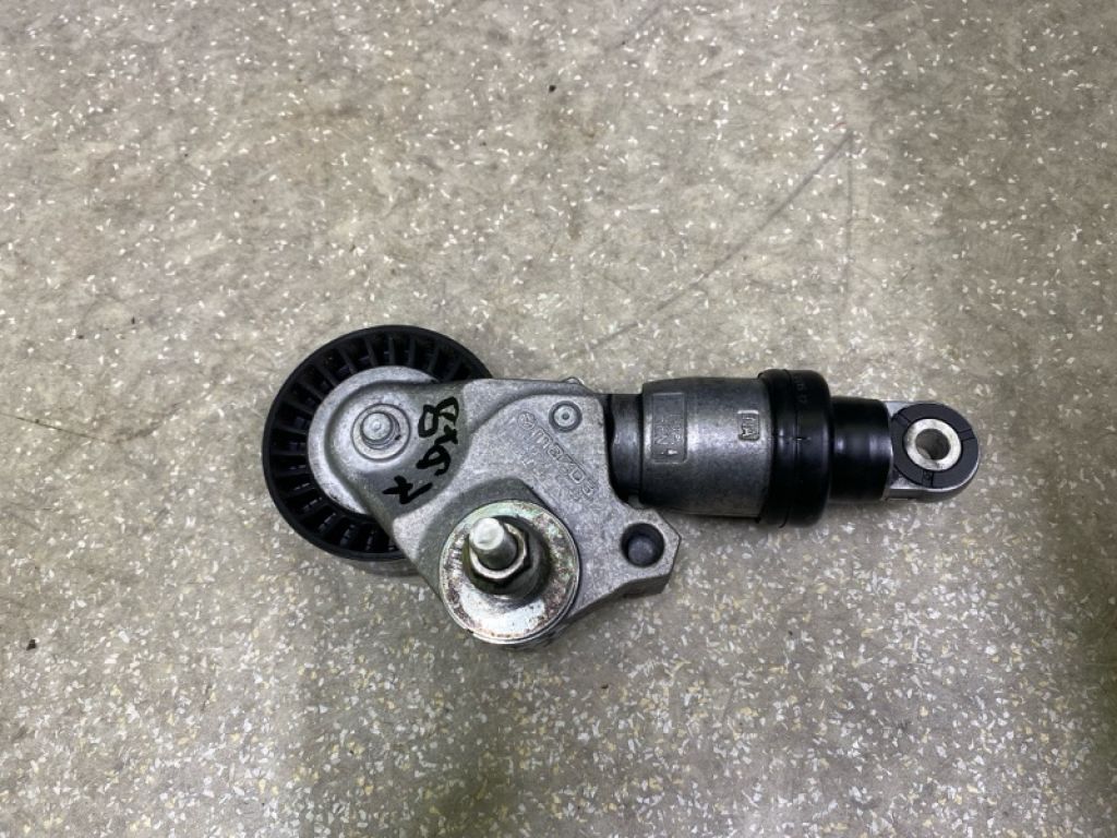 PE03-15-980B | Натягувач ременя генератора MAZDA CX-5 (KF) 16-21