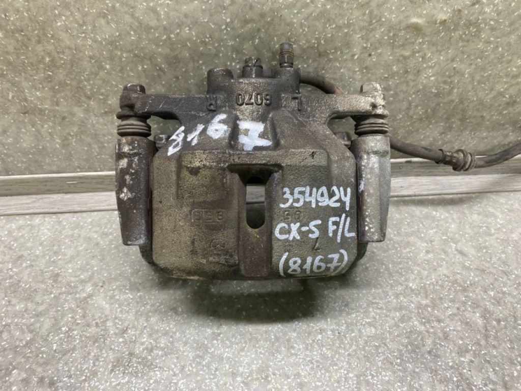 K0Y1-33-99Z | Супорт гальмівний передн. лів. MAZDA CX-5 (KF) 16-21