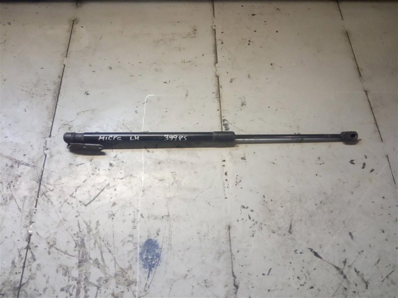 Амортизатор кришки багажника лівий NISSAN MICRA 03-11 90450-AX60B