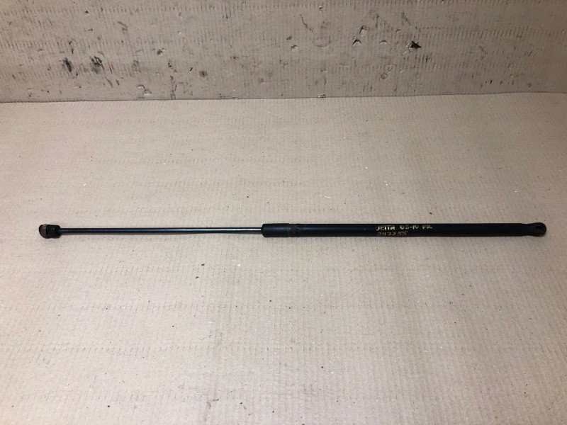Амортизатор капоту VOLKSWAGEN JETTA 05-10 1K0 823 359 A